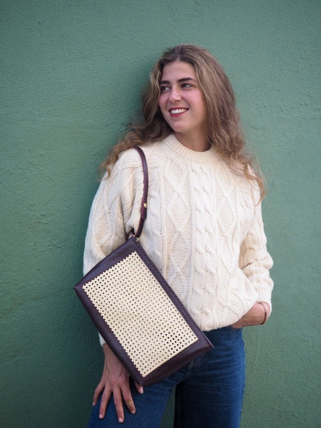 Burgundy  leather tote bag and clutch bag in handwoven rattan weave 